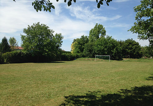 Football field campsite in the Jura