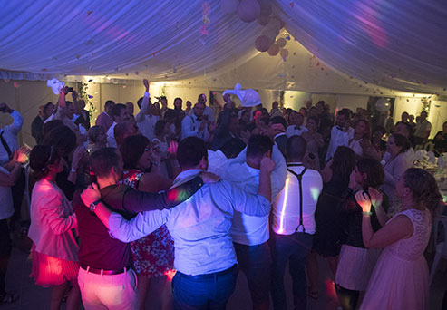 Party underneath the tent of the camping le Val d'Amour located in the Jura